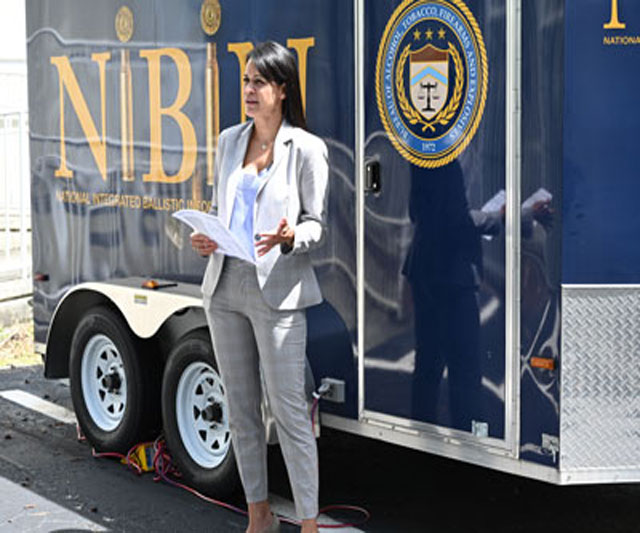 Supervisory Special Agent Jelissa Orcinolo in front of the NIBIN trailer