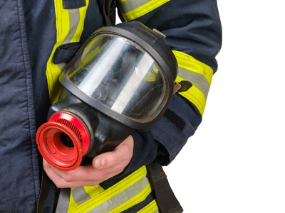 Firefighter holding equipment