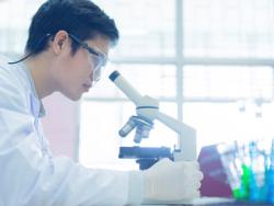 A forensic biologist works in the lab