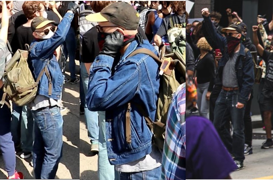 Masked, white male suspect in denim jean jacket and blue jeans with black gloves