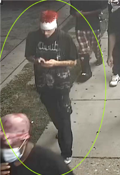Male in black shirt and pants with a red and white hat, identified as UNSUB #31.