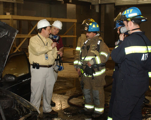Joseph Bertoni, local firefighters and ATF CFIs investigate an fire incident