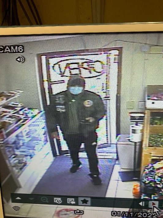 Camera view of person standing in store