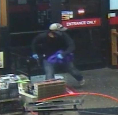Suspect shown entering the supply store