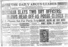 Image of The Daily Argus-Leader newspaper article, dated May 13, 1927, titled Chrisman Slays Two Dry Officers; Blows Head of as Posse Closes In