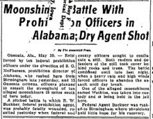 Image of a newspaper article with headline - Moonshine Battle With Prohibition Officers in Alabama; Dry Agent Shot