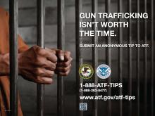 Anti-firearms trafficking poster featuring a man's hands on prison bars
