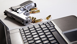 Image of a gun with a laptop