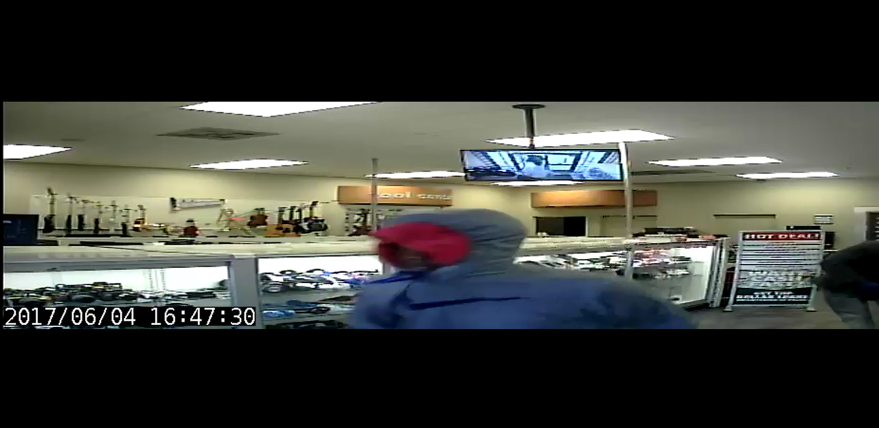 Security footage of suspect 4 during the EZ Pawn robbery.