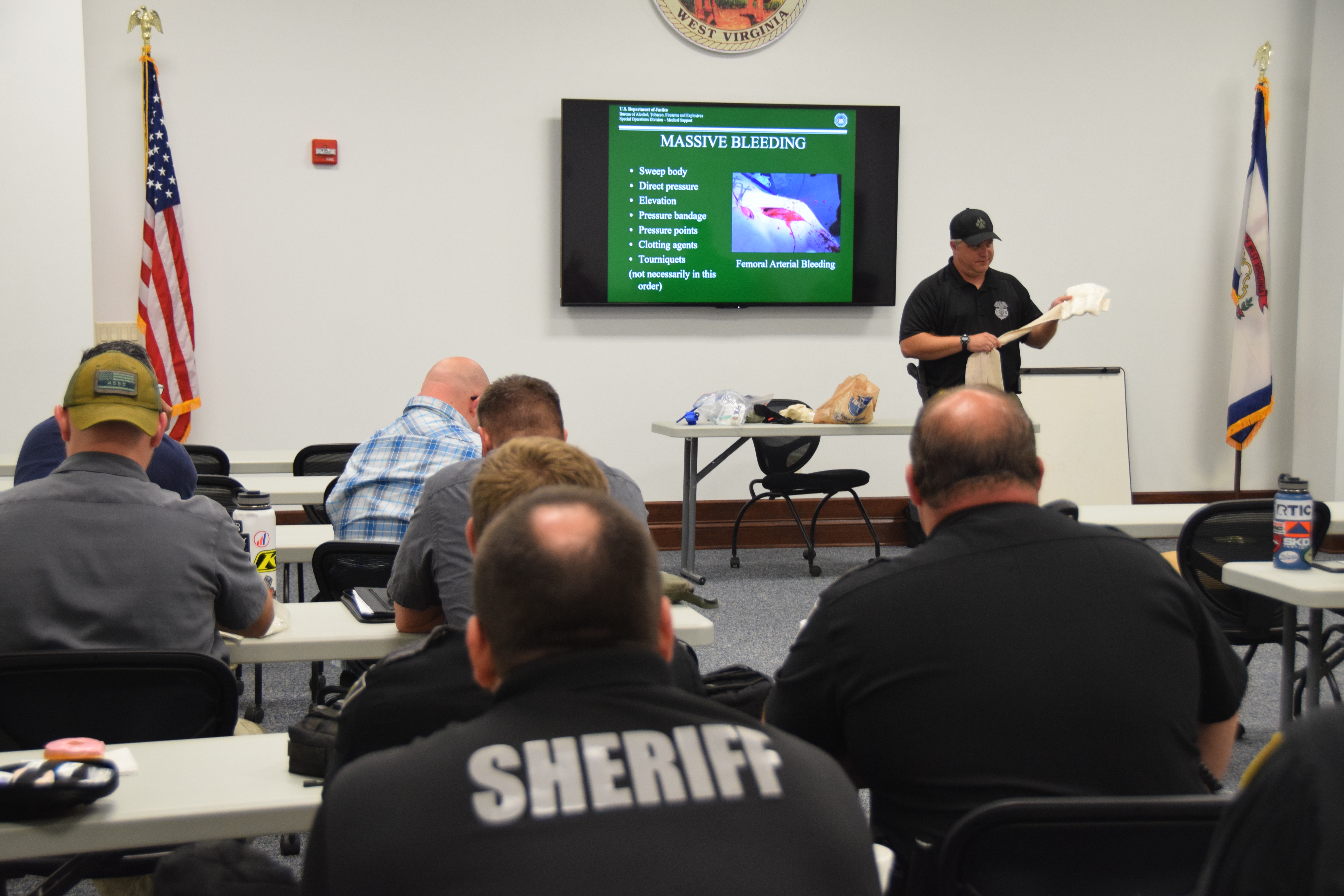 Image of law enforcement sitting in classroom training.