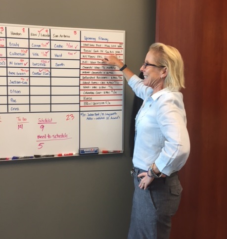 An image of Nicole Strong looking at upcoming filming log