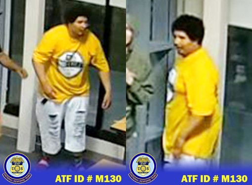 Male suspect wearing a yellow t-shirt and light blue ripped denim jeans