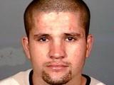 Picture of Ivan Reyes.  A wanted fugitive.