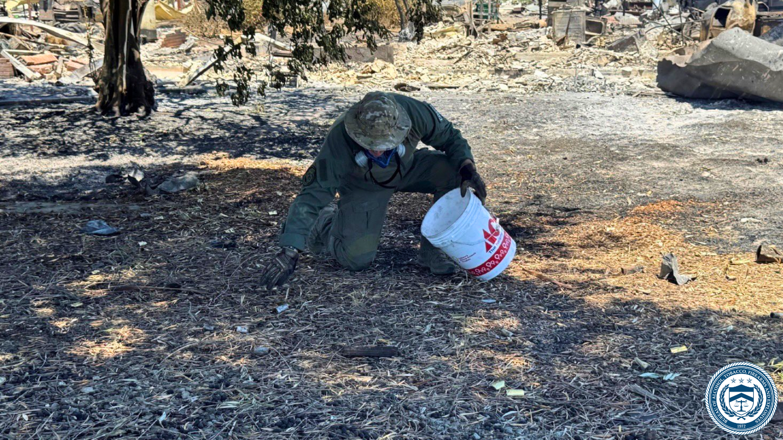 ATF National Response Team member searches for evidence.