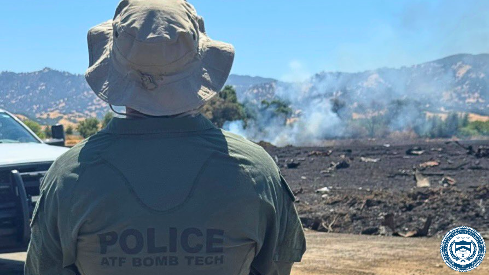 A member of the Bureau of Alcohol, Tobacco, Firearms and Explosives (ATF) National Response Team (NRT) looks at the overall area of the explosion in Esparto, California that happened on July 1.