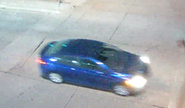 Still-frame photo from area video footage showing the car that was used as a getaway vehicle during the burglary. 