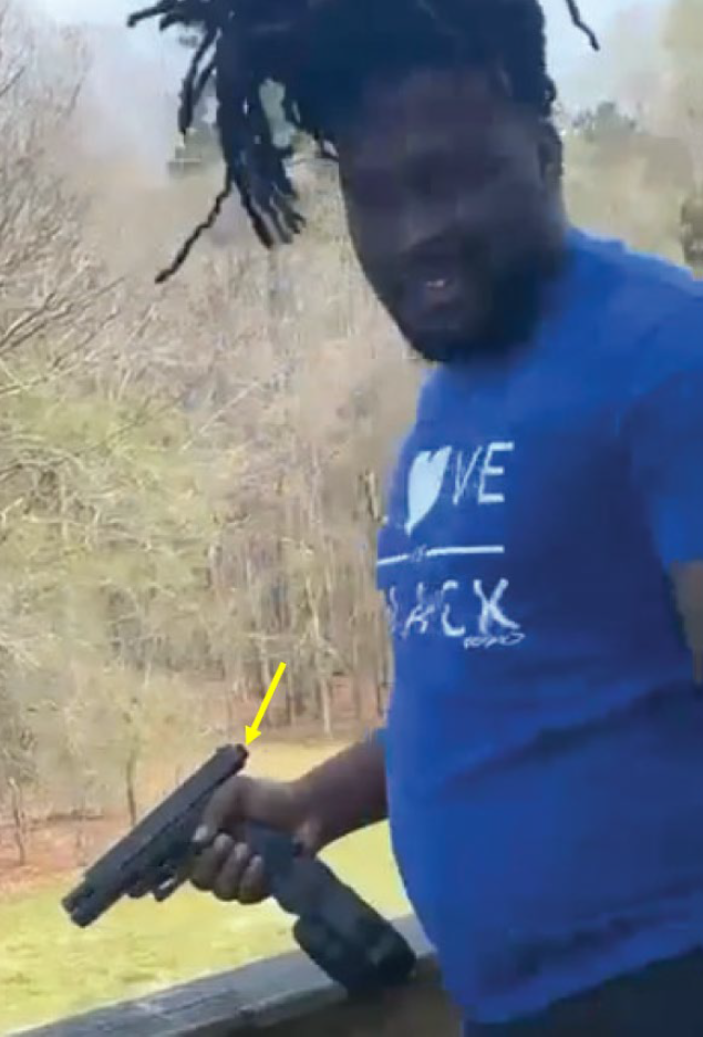 A screenshot of Edmond allegedly firing a fully automatic Glock pistol  pistol 