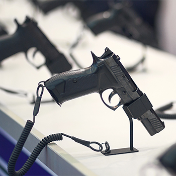 Multiple firearms attached to a counter