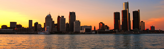 Image of the sun setting over Detroit, Michigan from the river