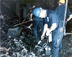 Picture of ATF agents sifting through the rubble of the Dupont Plaza Hotel.