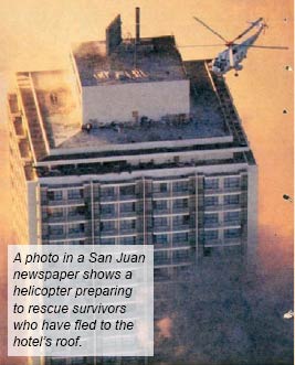 A photo in a San Juan newspaper shows a helicopter preparing to rescue survivors who have fled to the hotel roof.