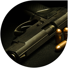 Image of a handgun and bullets