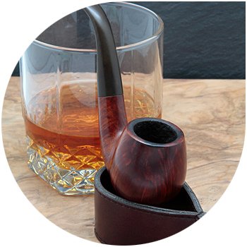 Image of a tobacco pipe and a glass of liquid