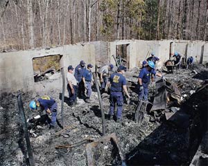 Historical Image of an ATF National Response Team investigating an arson scene.
