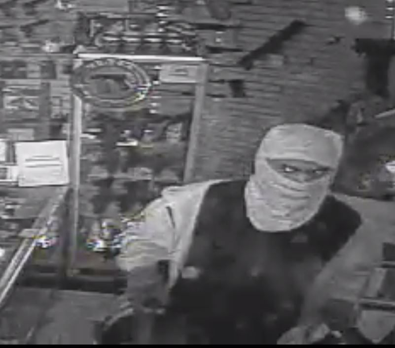 Image of subject one entering the store. 