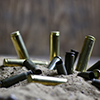 Image of bullets in the sand