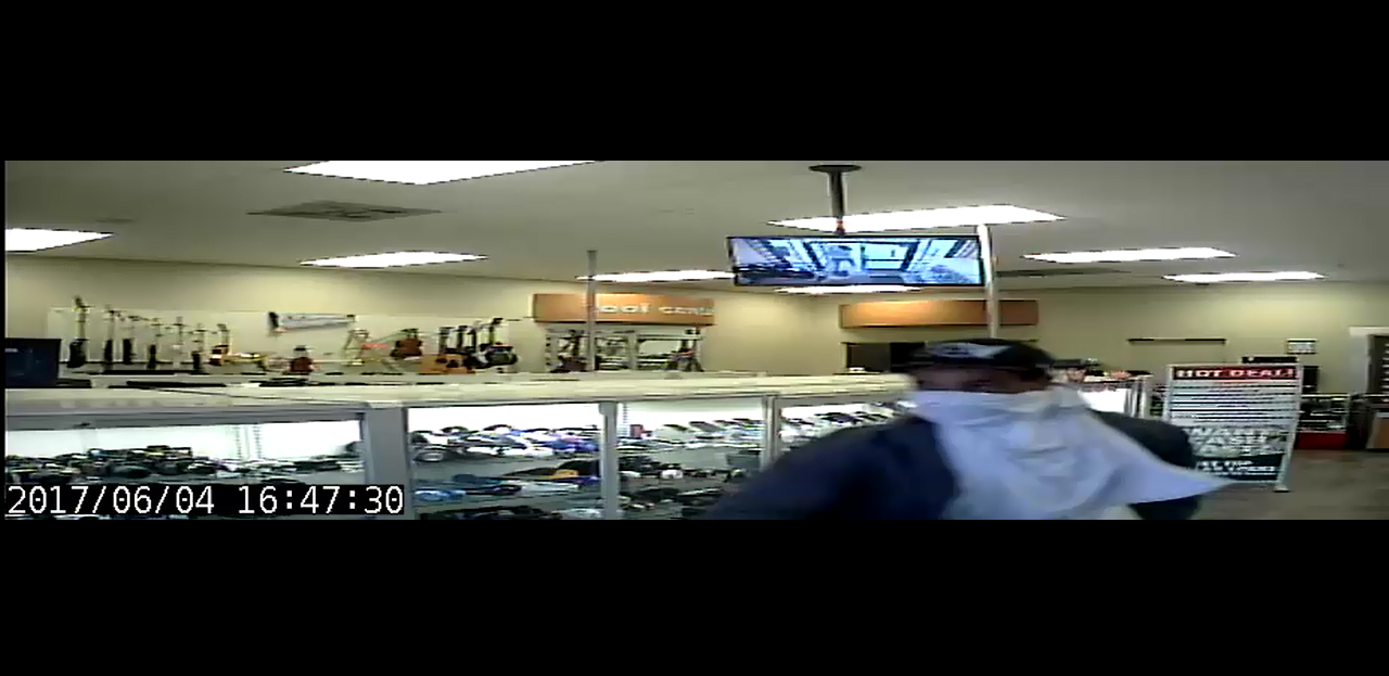 Security footage of suspect 2 during the EZ Pawn Robbery