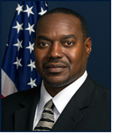 Headshot image of Special Agent in Charge Wayne Dixie in front of the American flag