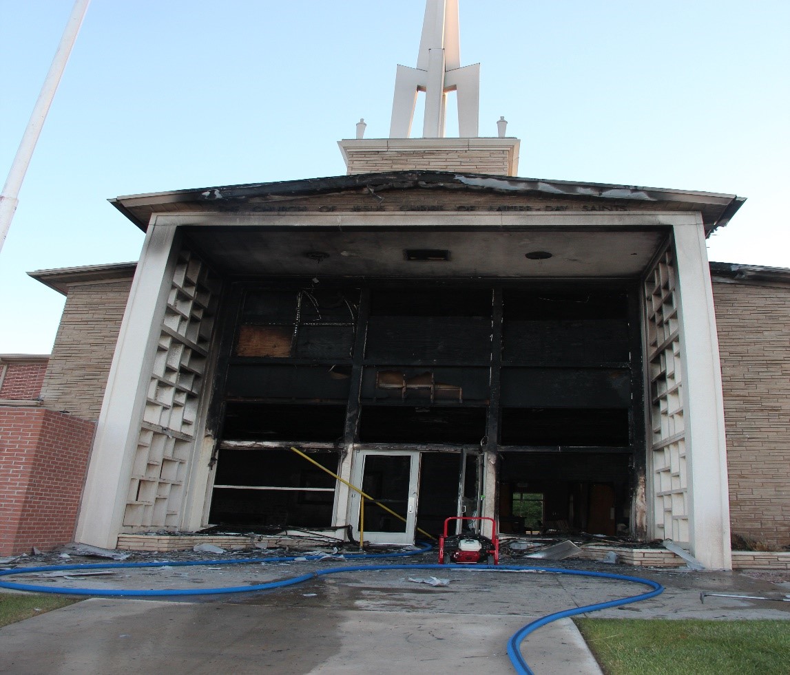 View of fire damage to the roof and outside main entryway of the church
