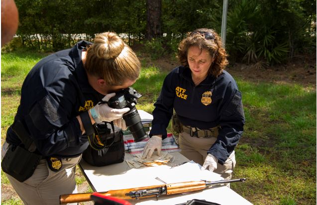 ATF special agents collect crime scene evidence 