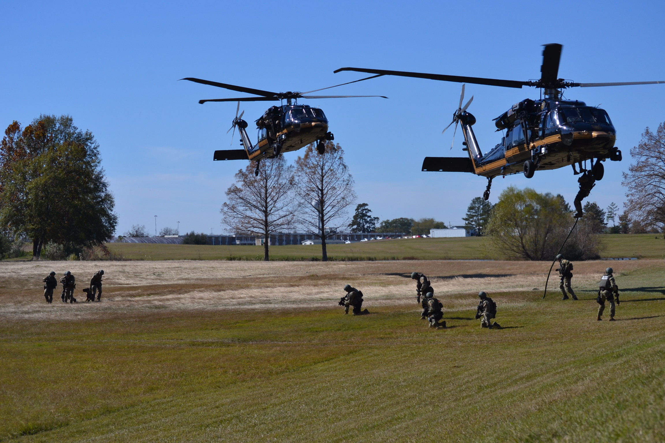 ATF Special Response Teams practice fast-roping from helicopters during training prior to an operation. 