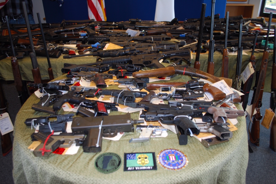 Close up of table displaying firearms