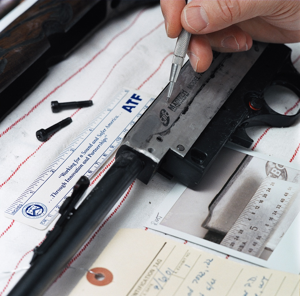 A forensics expert conducts a firearms trace