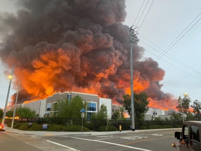 Amazon distribution center engulfed in flames.
