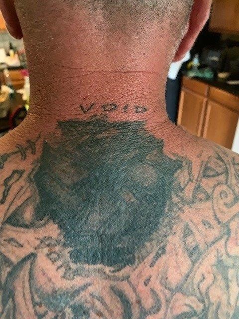 Man #2 with mutilated Unforgiven Brotherhood tattoo.