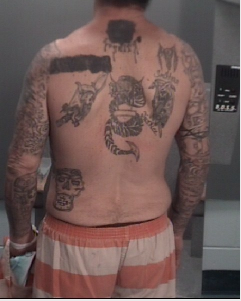 Man #3 with mutilated Unforgiven Brotherhood tattoo.
