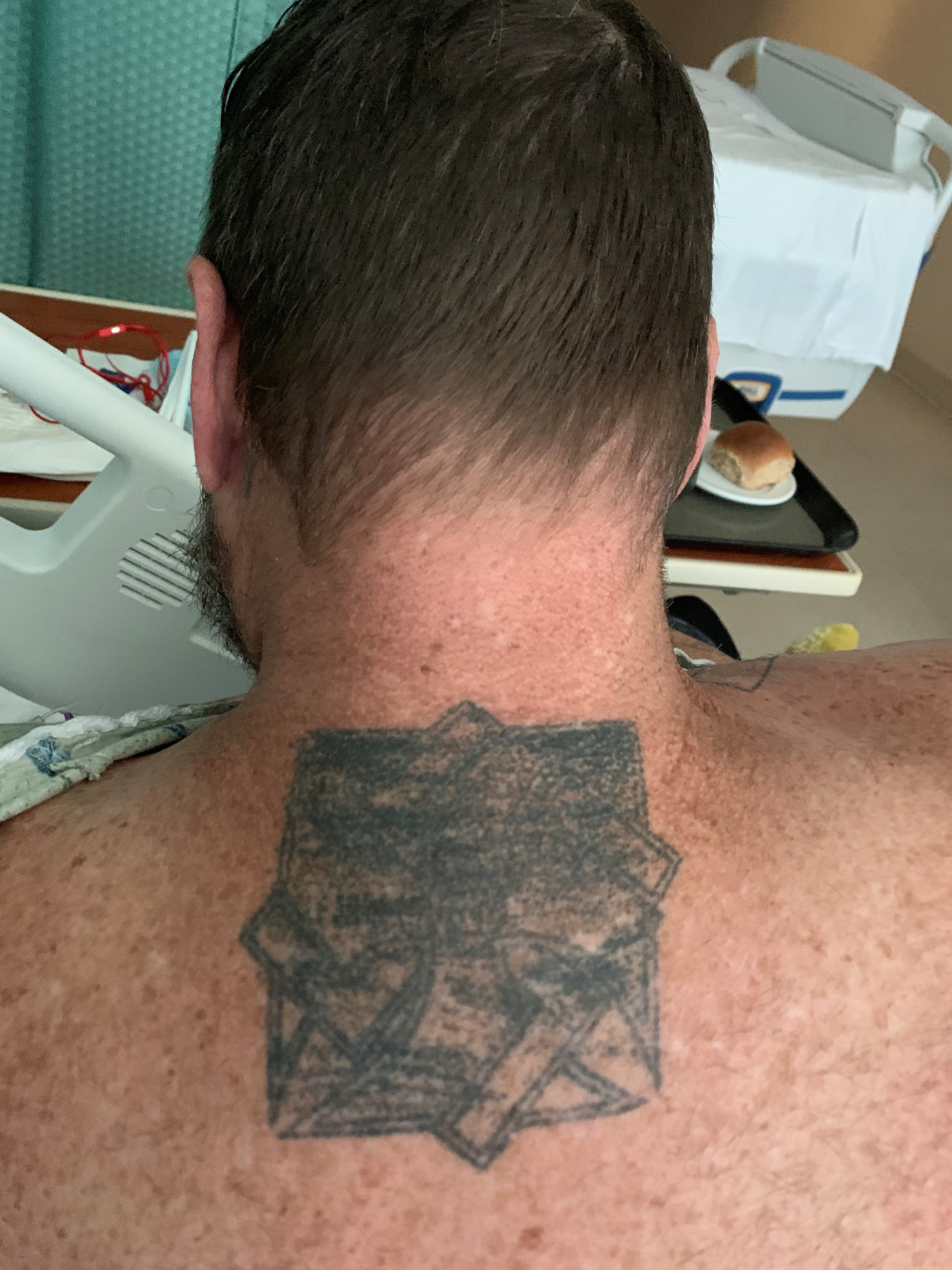 Man #1 with mutilated Unforgiven Brotherhood tattoo.