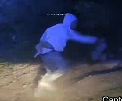 Suspect fleeing the scene in blue hoodie