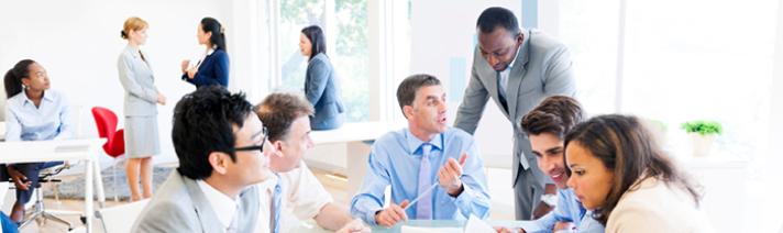 Group of people in an office interacting during a training