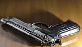 Handgun on a wooden table