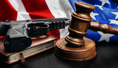 Gavel on wooden table with USA flag