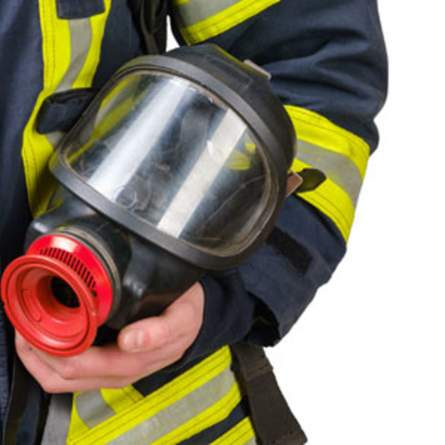 Firefighter holding equipment
