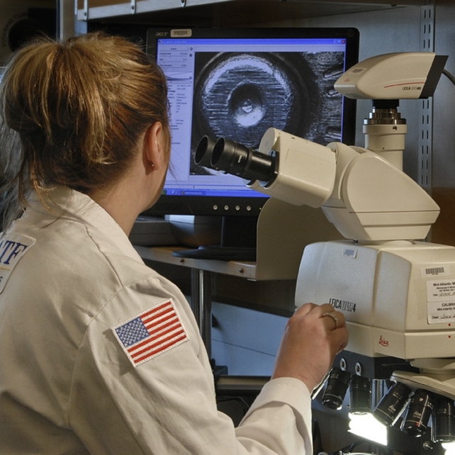 Scientist looking at Brasstrax machine
