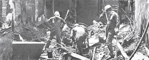 ATF agents stand in arson rubble at a 1979 Arson Investigation