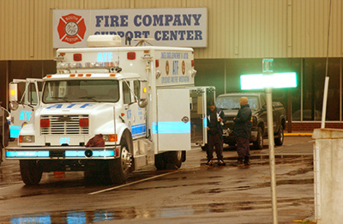 ATF National Response Team outside of the ATF truck at a crime scene