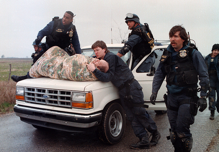 Agents escort a wounded Bill Buford